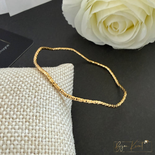 Ajda Armreif Wellen Edelstahl 18K vergoldet Größe 64 mm